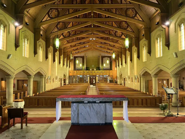 The warm interior of St Joseph's Church looking toward the sanctuary