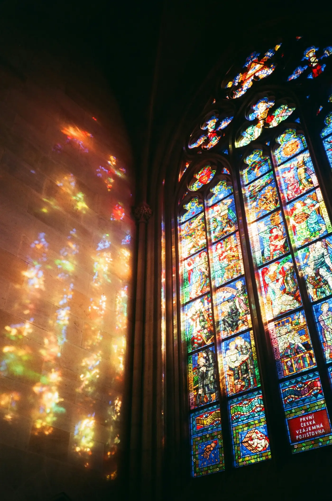 Light streaming through the stained glass windows of the church
