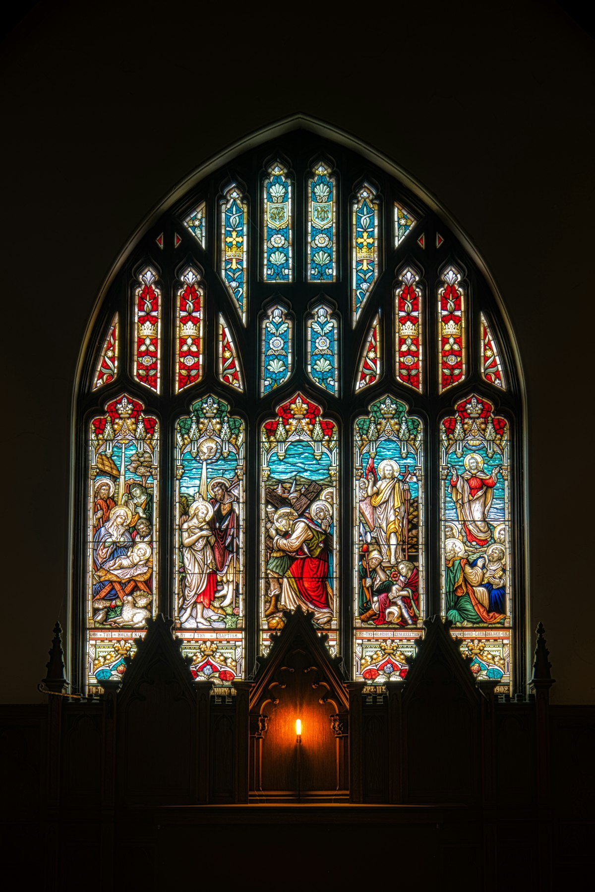 A richly coloured religious stained glass window