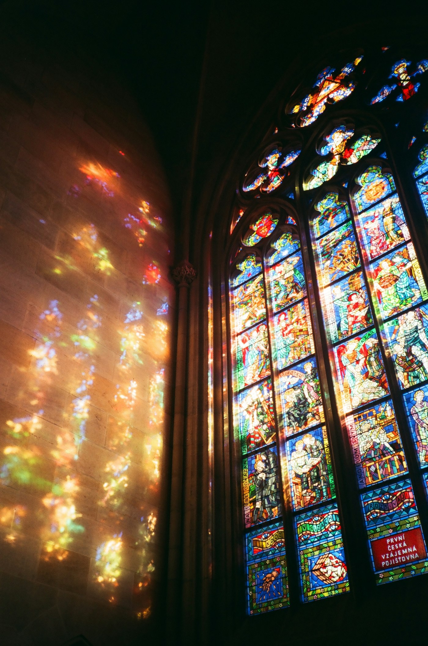 Sunlight streaming through a stained glass window